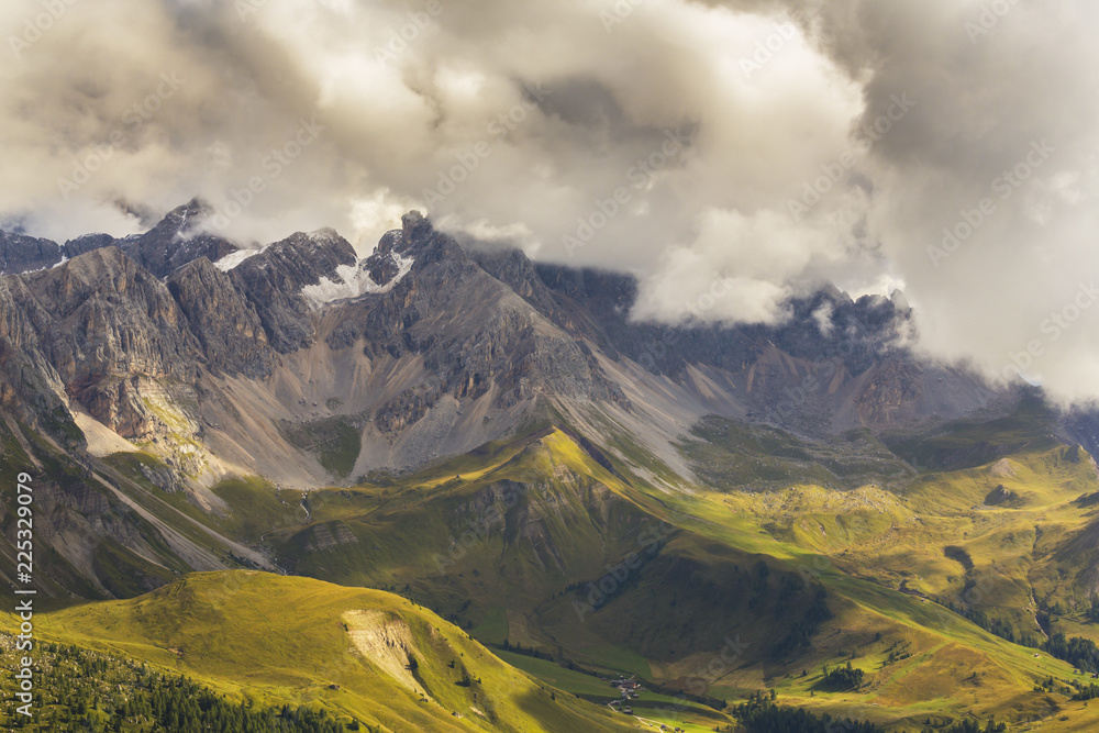 Beautiful summer scenery in the Dolomite Alps, Italy, with dramatic storm clouds