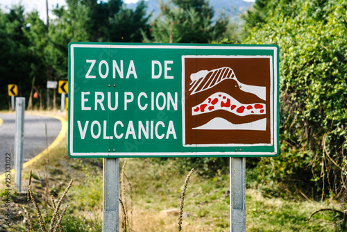 "Volcanic Eruption Zone" street sign in Spanish where lava is likely to flow during an eruption in Chile