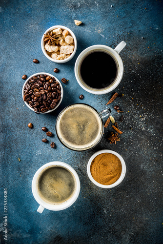 Coffee cups with beans and ground coffee