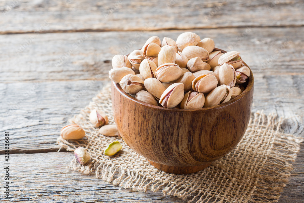 Delicious salted pistachios on a plate Copy space Delicious salted pistachios on a plate Copy space