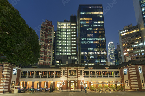 Photography Old and modern high rise buildings in Hong Kong city at night