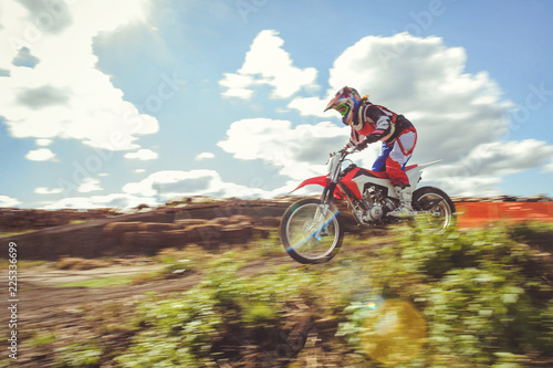 woman on enduro motocross in motion  desire for victory  dynamics of speed