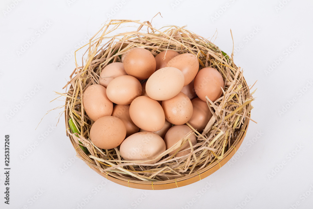 Hen or chicken eggs basket on the hey Hen or chicken eggs basket on the hey