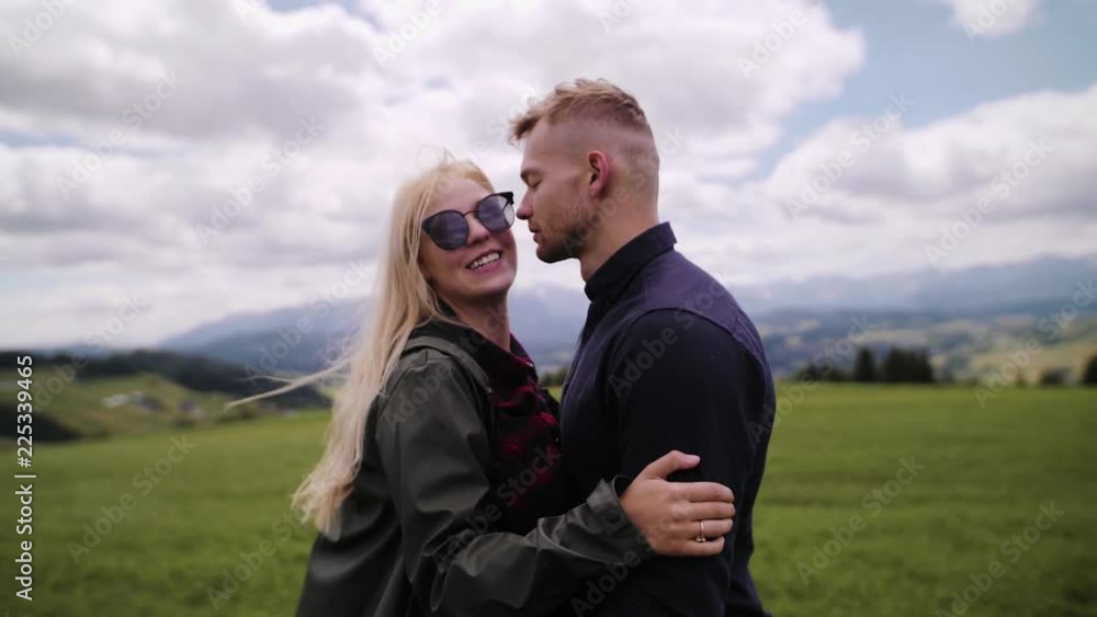 Portrait of couple kissing and hugging in mountains Slow motion Portrait of couple kissing and hugging in mountains Slow motion