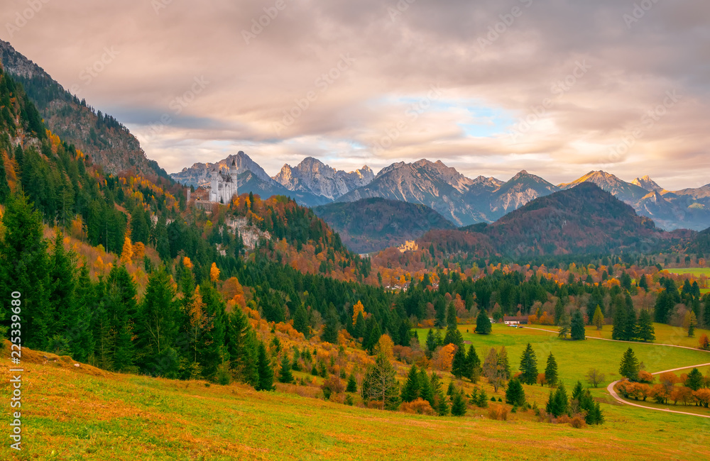 Scenic view of Alpine valley with Neuschwanstein and Hohenschwangau castles at autumn morning