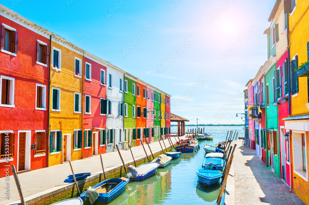 Scenic canal with colorful buildings in Burano, Venice, Italy