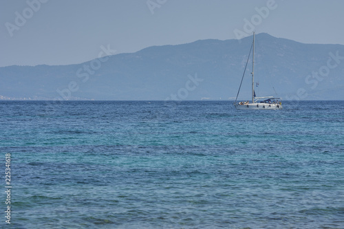 Hanioti, Greece - 09/01/2018 - Yacht and blue water Mediterranean sea. Fun, sport,  lifestile concept.