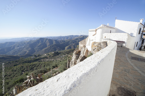 Comares, white village up on the hill of Malaga mountains, Andalusia, Spain. Townhouses photo