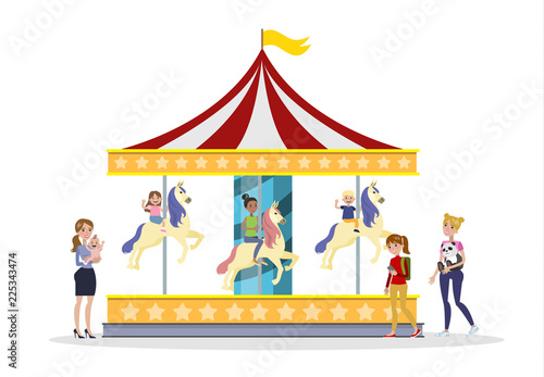 Children having fun on the merry go round