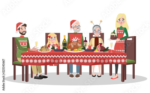 Happy family sitting at the christmas table.