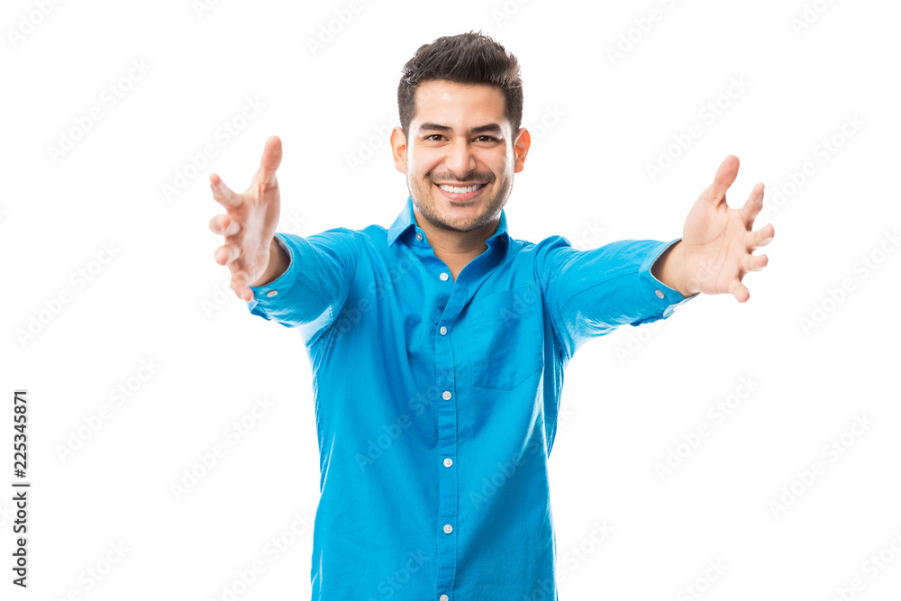 Affectionate Male Smiling While Offering A Hug Affectionate Male Smiling While Offering A Hug