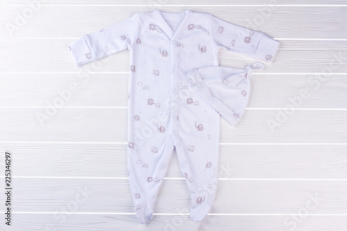 White footed baby pajama and knot hat.