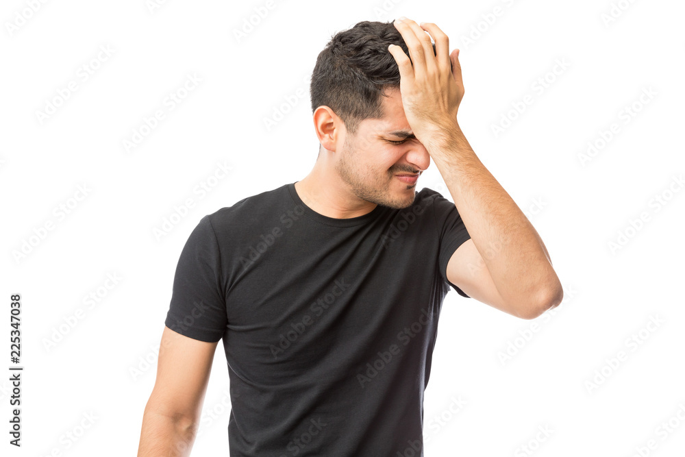Upset Young Man Suffering From Headache Upset Young Man Suffering From Headache