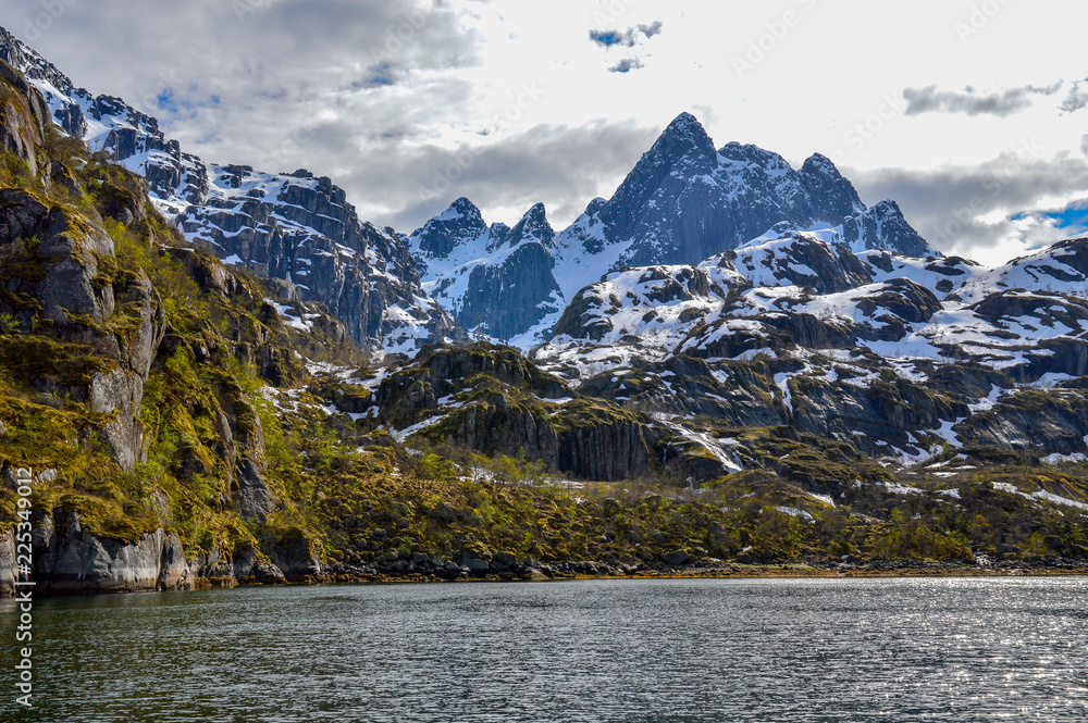 Fjord in Lofoten with snowed mountain, Norway. Fjord in Lofoten with snowed mountain, Norway.