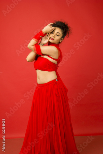beautiful indian female model in a red flowy dress