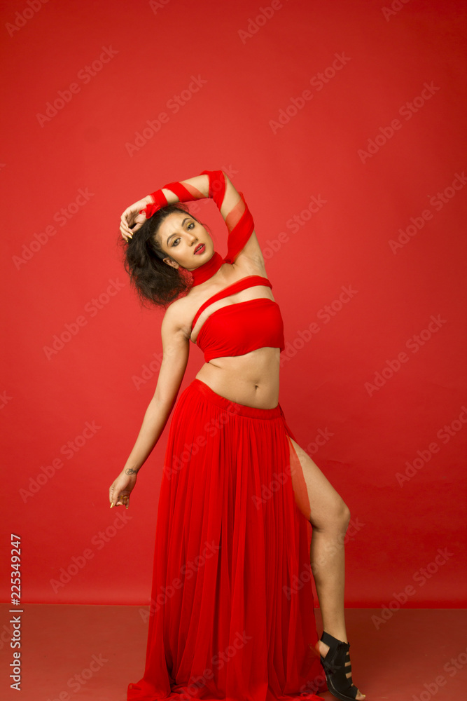 beautiful indian female model in a red flowy dress beautiful indian female model in a red flowy dress