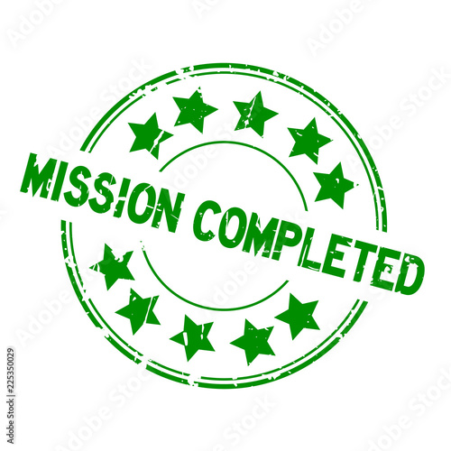 Grunge green mission completed with star icon round rubber seal stamp on white background