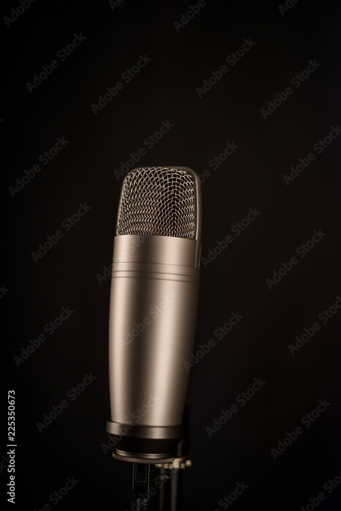 studio microphone on black background studio microphone on black background