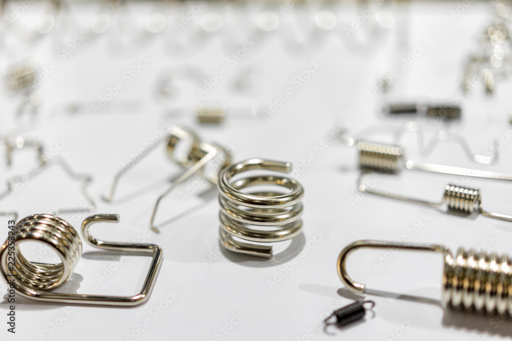 Metal spring parts of automotive manufacturing by high precision machine in the factory Metal spring parts of automotive manufacturing by high precision machine in the factory
