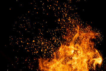 Fire sparks with flames on black background