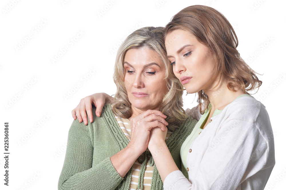sad senior woman with daughter on white background sad senior woman with daughter on white background