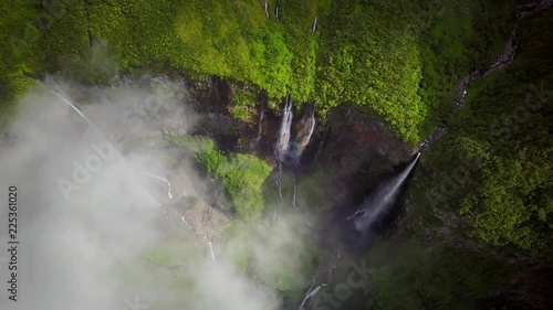 Aerial view of waterfalls and people canyoneering in Reunin island. photo