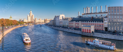 Moscow. September 20, 2018. View from the soaring bridge in the park Zariadye. Moskvoretskaya and Raushskaya embankments. Moscow River. Stalinist skyscraper on the Kotelnicheskaya Embankment. photo