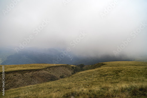 Landscape with curtains of torrential heavy rain in the mountains