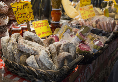 image with detail of wicker baskets with typical Italian salami of wild boar and deer photo