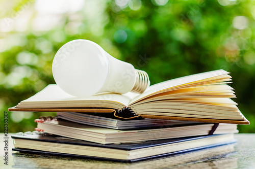 LED lamp on stack of opened...