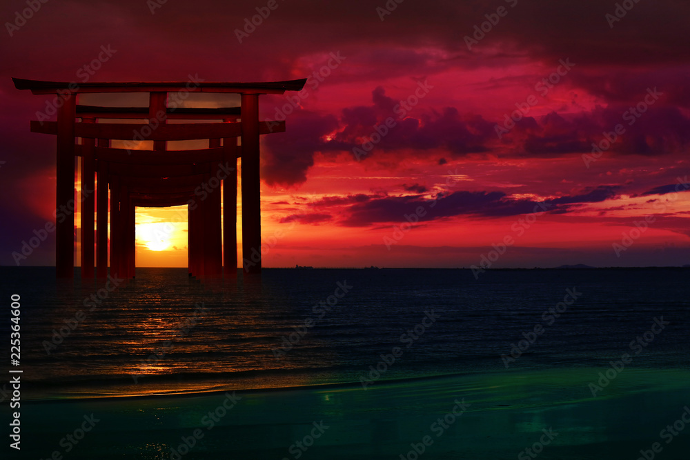 Naklejka premium silhouette torii wooden Japanese pillar stand on over the sea and sunset sky