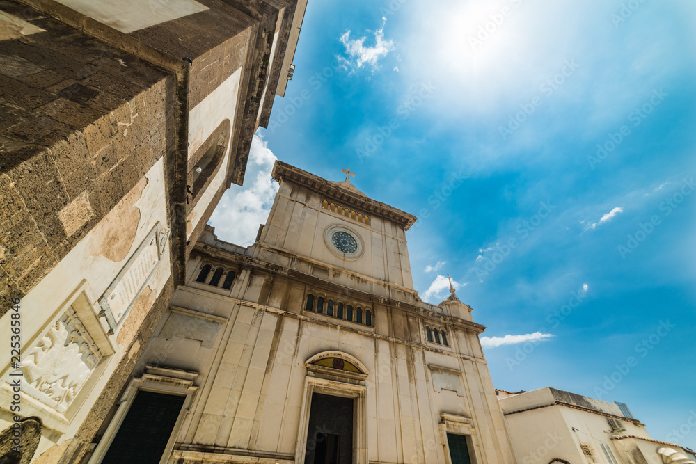 Sun shining over Santa Maria dell'Assunta church in Positano