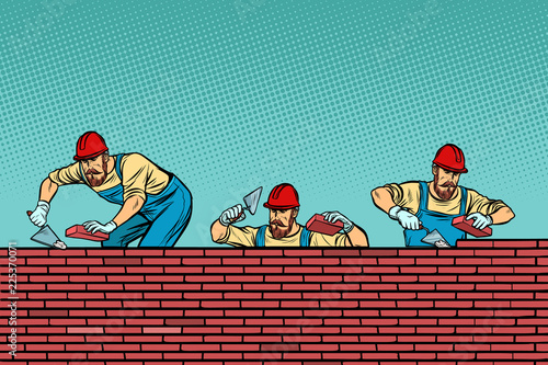 construction team laying a brick wall background
