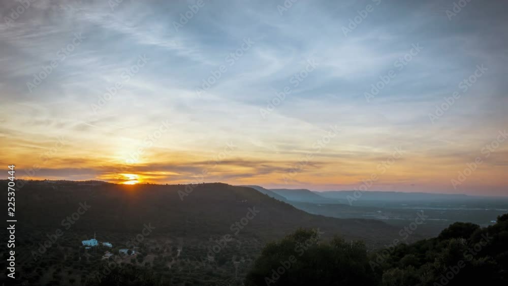 Stunning sunset on the hills between Ostuni and Cisternino with panoramic view on the expanses of olive trees of the plain of Fasano Stunning sunset on the hills between Ostuni and Cisternino with panoramic view on the expanses of olive trees of the plain of Fasano