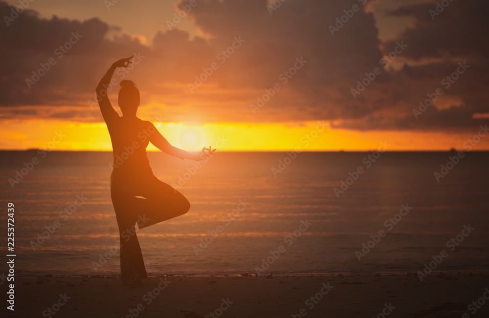 Yoga on the beach Silhouette style.stance