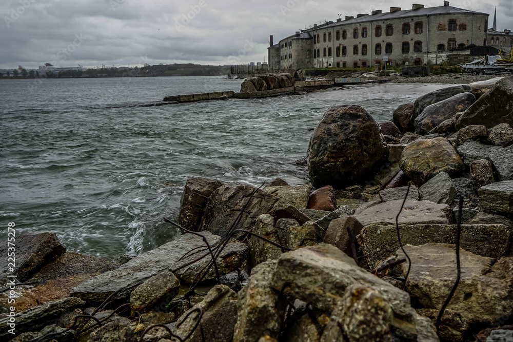 Tallinn / Estonia- 15.3.2018: Old Soviet Union time prison. Sea Fortress Patarei, Patarei Prison. Stone construction by the Baltic sea. View from the sea side. abandoned looking old house.