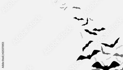 Halloween flying bats background. Creepy silhouette flittermouse group isolated on white. Vector illustration.