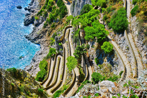 Overlooking the beautiful coastline and switchback footpath on the Capri Island in Italy in summer. 