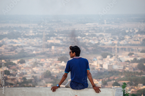 Boy looking at city