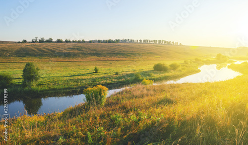 Wallpaper Mural Sunny summer landscape with river flowing between the beautiful green hills,fields and meadows. Torontodigital.ca