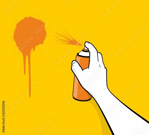 Ręką człowieka za pomocą malowania natryskowego pomarańczowy