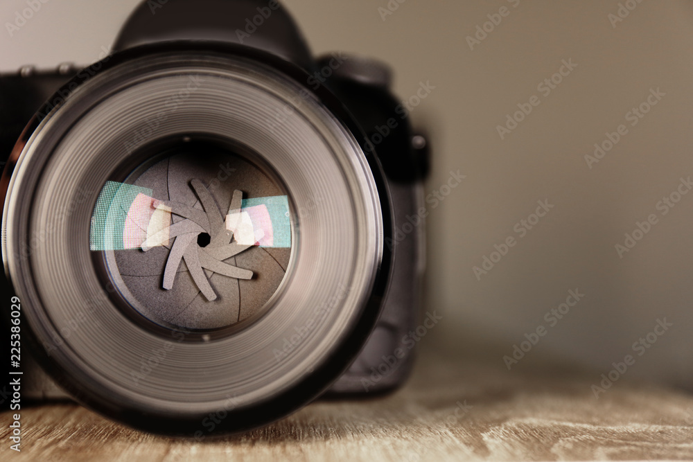 Digital camera of professional photographer on table. Space for text Digital camera of professional photographer on table. Space for text