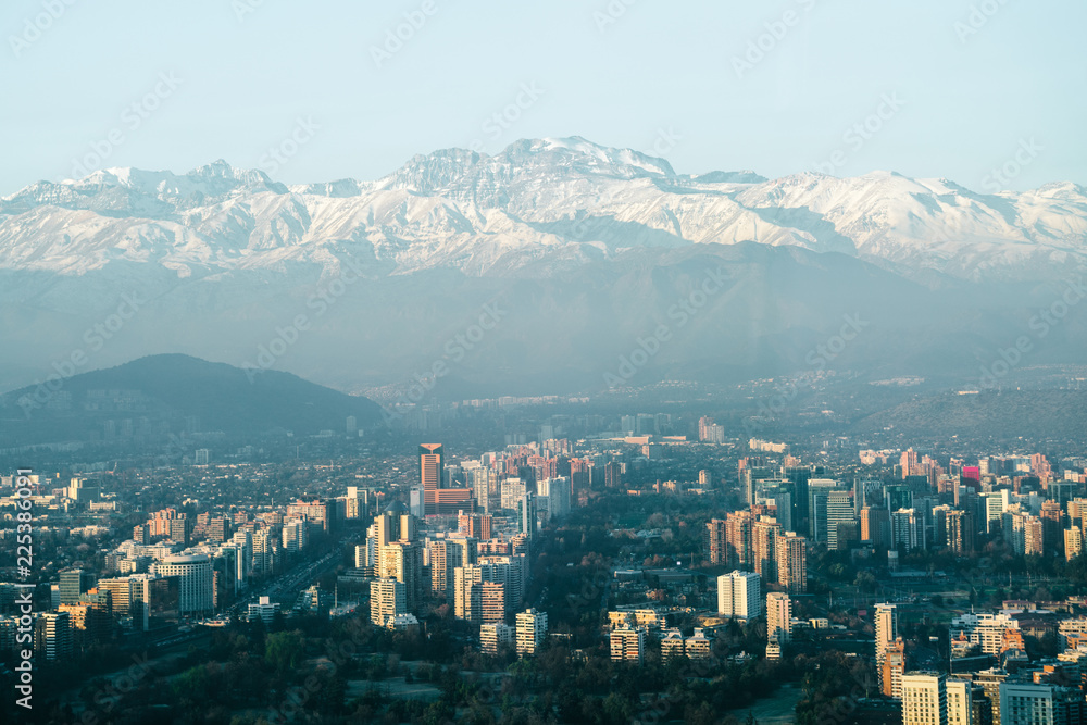 Fototapeta premium Urban sprawl in the city of Santiago in Chile with the Andes Mountains in the background