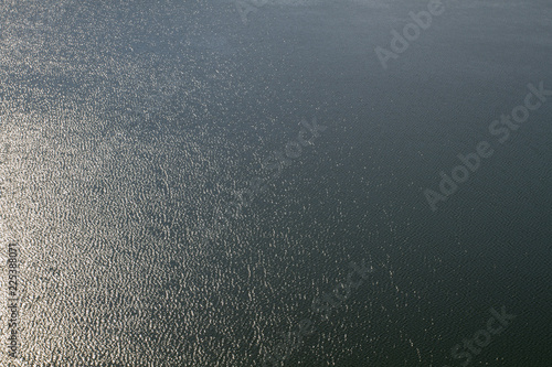 Texture water . Sea texture background and light from the sun . For add text . Abstract background photo.
