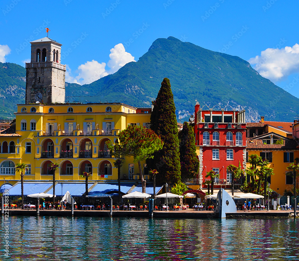 Beautiful view of Riva del Garda, of the embankment, cafes and restaurants. Lake Garda, region Lombardia, Italy