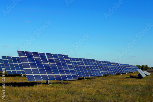 Solar panels against the blue sky, ecological power station.