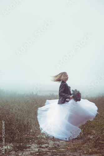 bride dancing in the field