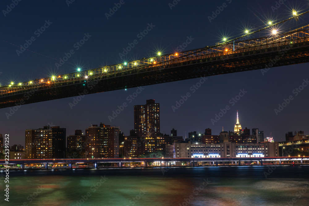 brooklyn bridge and manhattan at night