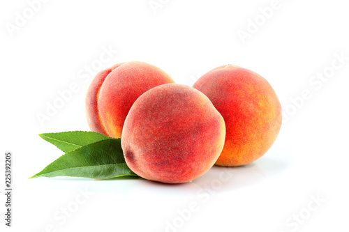 Fresh peach fruits with leaf isolated.
