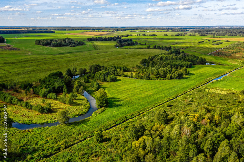 Aerial view on rural landscape with a river